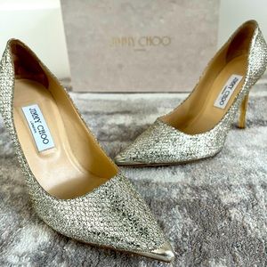 JIMMY CHOO ROMY SILVER GLITTER FABRIC HEEL PUMPS.